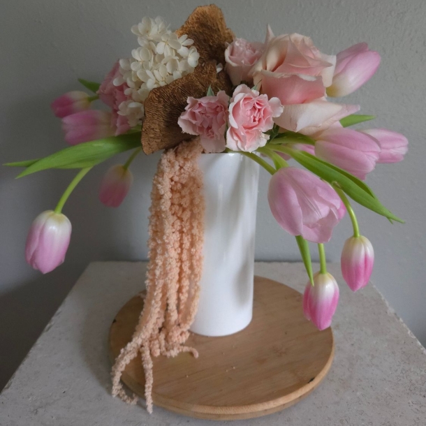 Ana floral arrangement in white vase with pink tulips, blush roses, white hydrangea and cascading amaranthus
