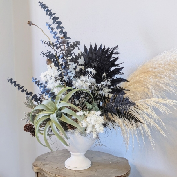 Colette dried floral arrangement in a white pedestal vase with eucalyptus, ferns, pampas grass and air plant