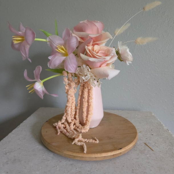 Galentine’s floral arrangement with pink roses, lavender blooms, and cascading pink amaranthus in a blush vase